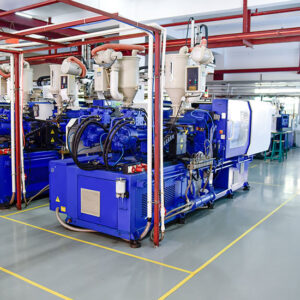 row of plastic injection machines at empty clean workshop