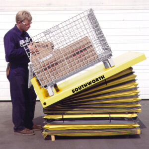 Worker using a Southworth Lift Table with Bellows Skirt.