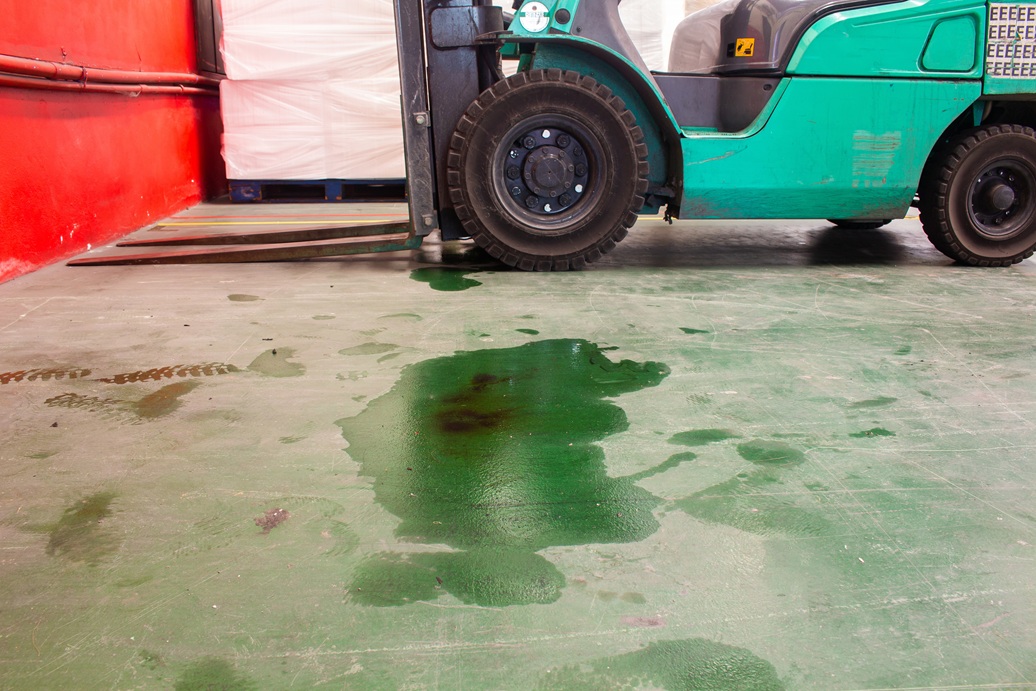Lubricating oil stains of forklift trucks on the ground Lubricating oil stains of forklift trucks on the ground